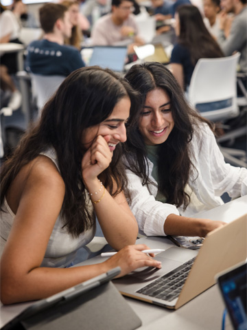 A group of two students working together in the 360 classroom A group of two students working together in the 360 classroom